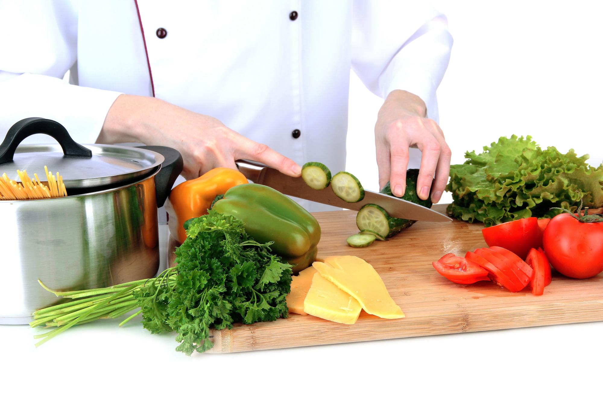 Students chopping vegetables